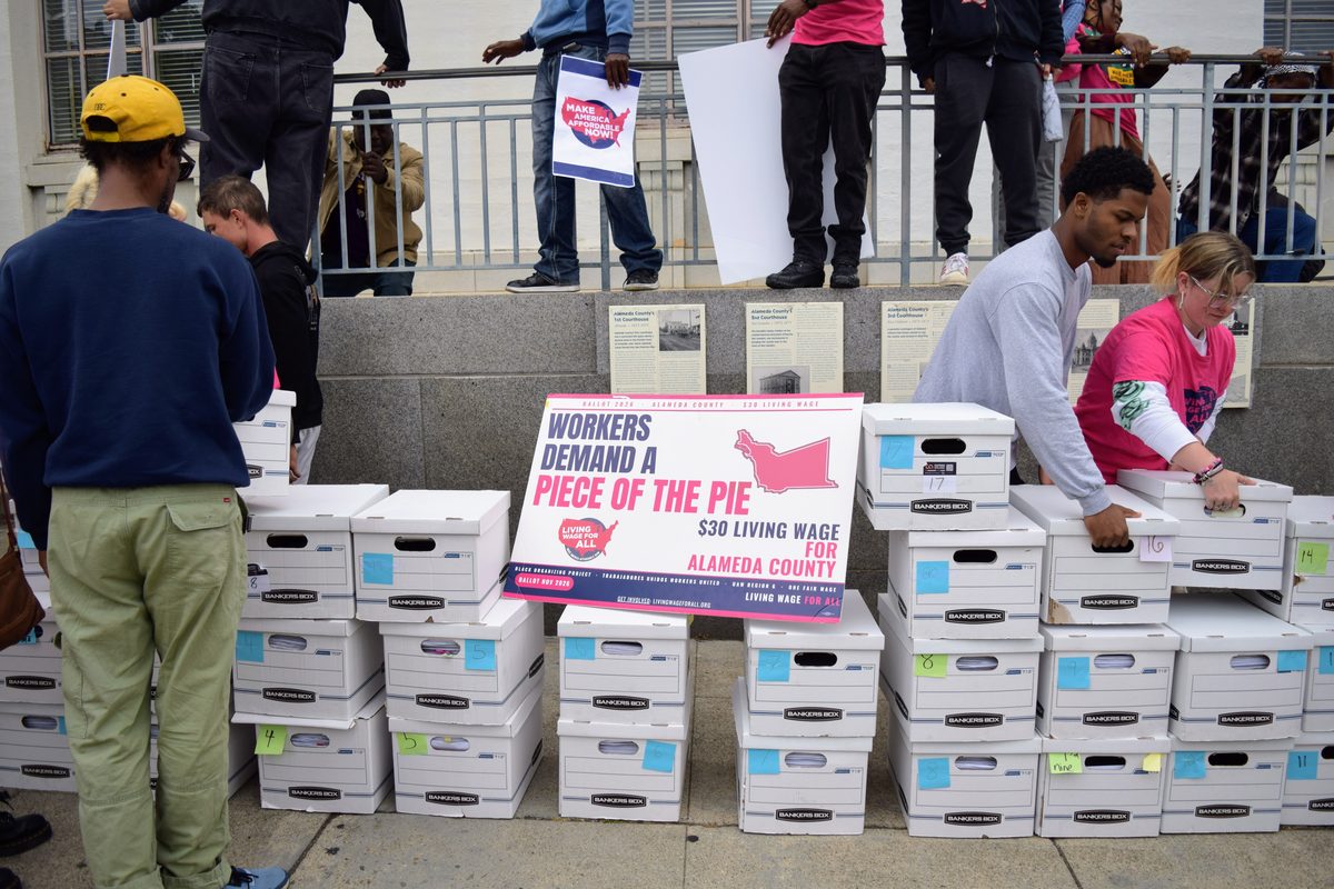 Boxes of signed petitions for the $30 Alameda County ballot measure at the Registrar turn-in