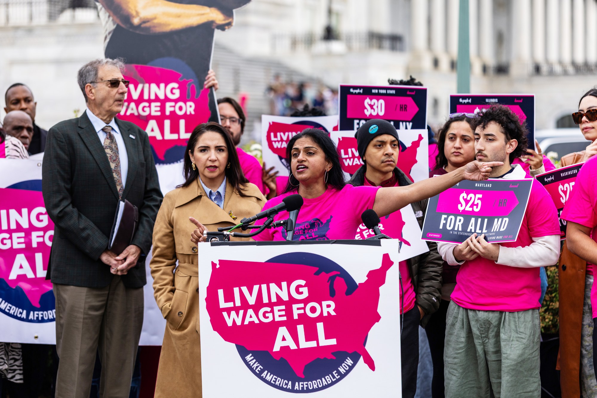 Saru Jayaraman, President of One Fair Wage, speaks at the U.S. Capitol surrounded by OFW members at the Living Wage For All Act launch